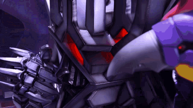 a close up of a robot with a red light on its head