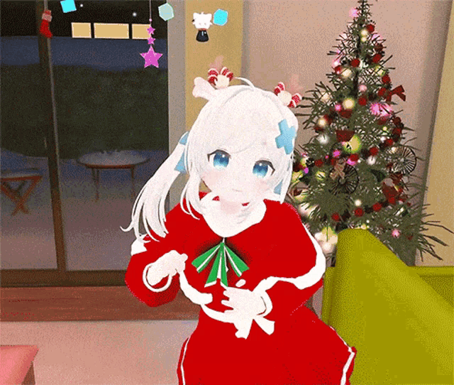 a girl in a red dress is standing in front of a christmas tree in a living room