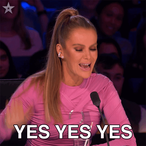 Amanda Holden celebrates at a judging desk with “YES YES YES.”