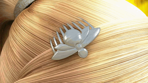 a comb with a bee on it is on a woman 's hair
