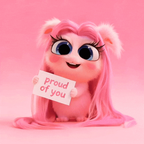A pink fuzzy cartoon creature holds a “proud of you” card.