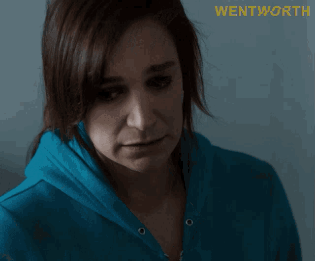 a woman says yeah okay in front of a wentworth poster