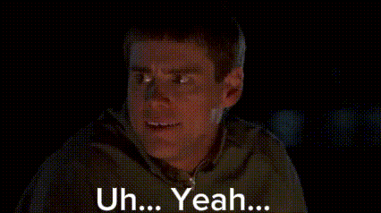Jim Carrey looks sideways in a dark scene, captioned “Uh... Yeah...”.