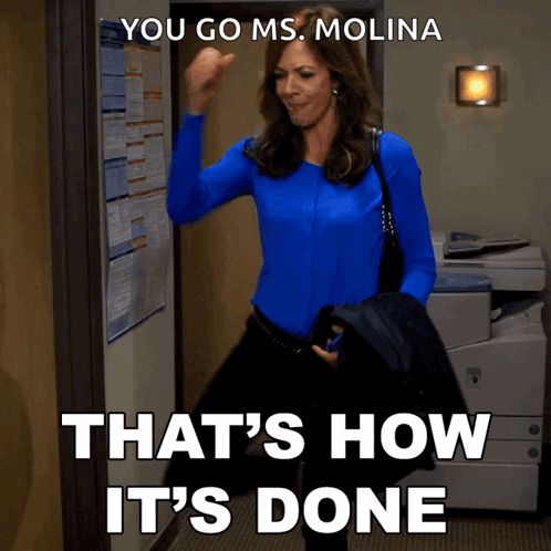 a woman in a blue shirt says " you go ms. molina that 's how it 's done " in white letters