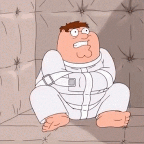 Peter Griffin sits restrained in a padded room.