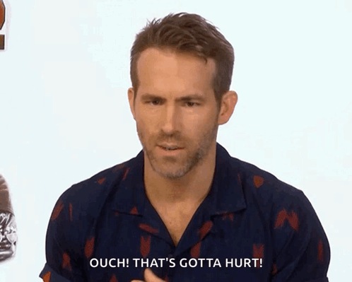 Ryan Reynolds looks worried as the caption says “OUCH, THAT'S GOTTA HURT.”