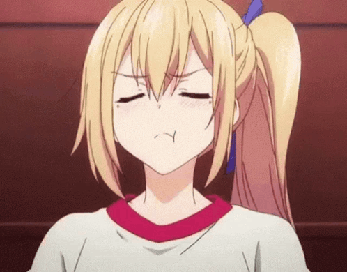 An anime girl closes her eyes with an annoyed expression.