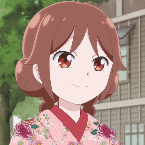 A rosy-cheeked anime girl smiles softly toward the viewer.