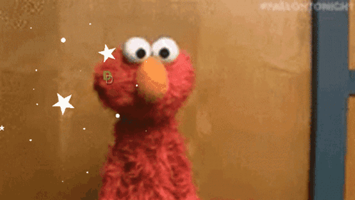 Elmo stares wide-eyed amid sparkling stars, conveying uncertainty.