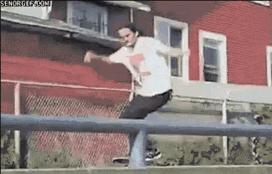 a man is doing a trick on a skateboard on a railing .