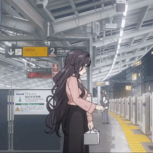 a woman stands in front of a sign that says " t train "