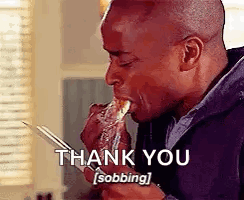 a man is eating a piece of food with chopsticks and a thank you sobbing .