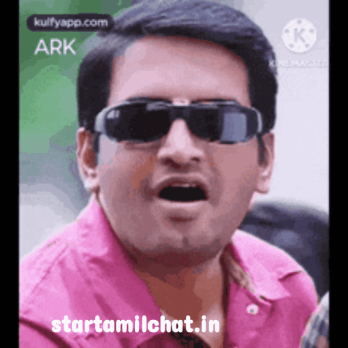 A man in dark sunglasses and a pink shirt gives an animated “WOW” reaction.