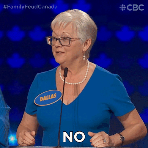 a woman in a blue shirt with the name dallas on it says no