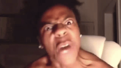 a man without a shirt is making a funny face in a chair .