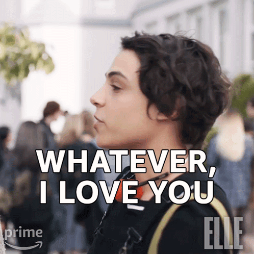 Woman leans toward another person saying “WHATEVER, I LOVE YOU.”