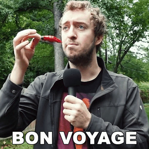 a man is holding a microphone and eating a red pepper with the words bon voyage written above him