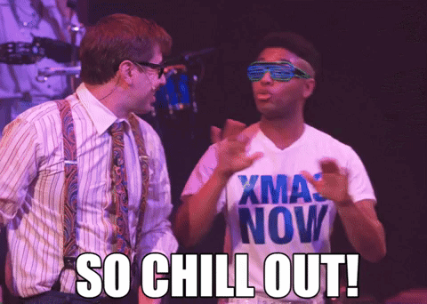 Two performers face each other onstage as the caption commands “SO CHILL OUT!”