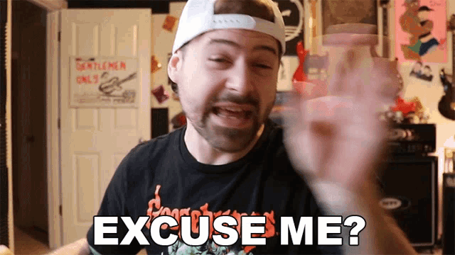 a man wearing a white hat and black shirt says excuse me