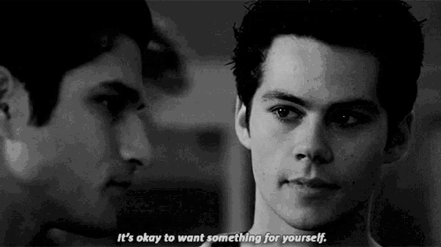 two young men are looking at each other and one of them is saying it 's okay to want something for yourself .