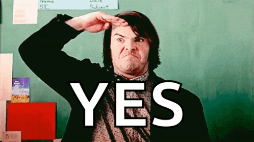 Jack Black salutes with a broad smile and a large “YES.”