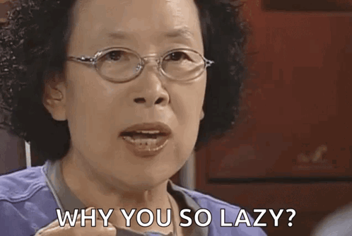 An older woman speaks sternly with the caption “WHY YOU SO LAZY?”