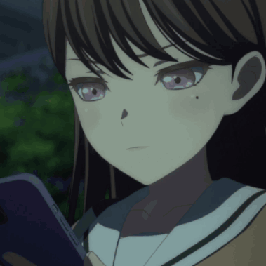 a close up of a girl with purple eyes looking at her phone