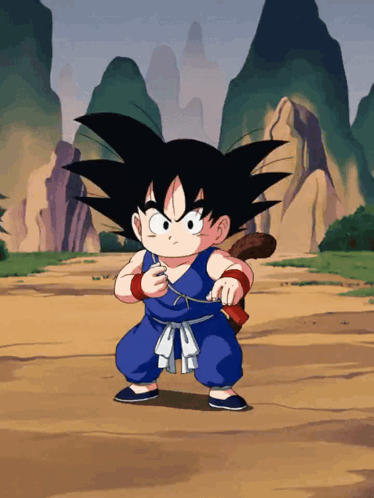 a cartoon character named goku is standing on a dirt field with mountains in the background