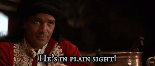 a man in a red and gold outfit says he is in plain sight