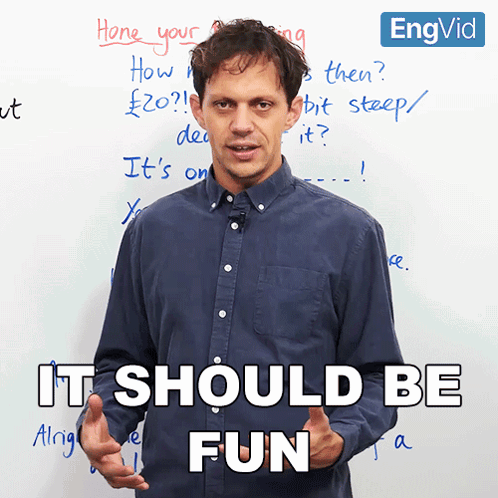 a man standing in front of a white board with the words it should be fun written on it