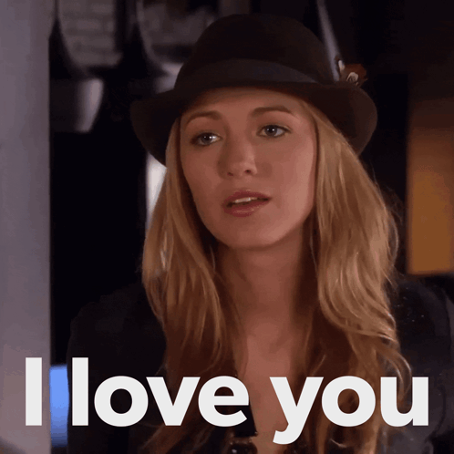 a woman is wearing a hat and says i love you
