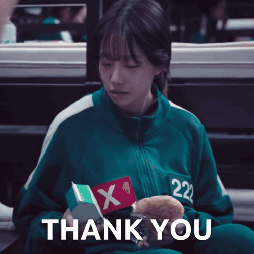 a girl in a green uniform with the number 222 on it