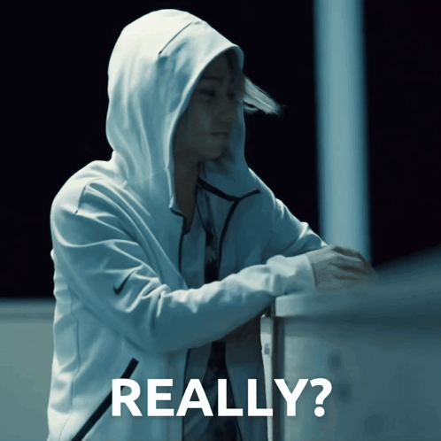 a person wearing a white hoodie with the word really on the bottom right