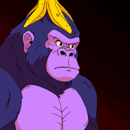 a gorilla with a banana on its head looks angry