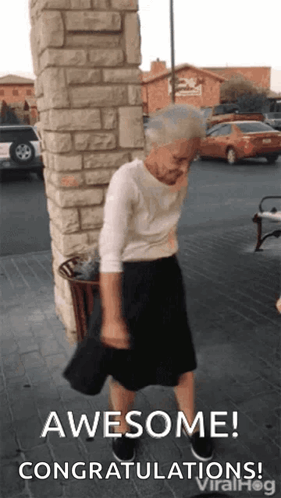 An older woman dances outdoors under “AWESOME! CONGRATULATIONS!”