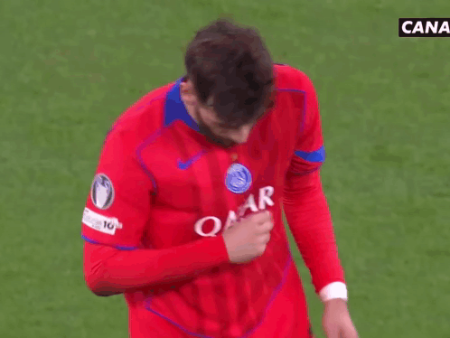 a man wearing a red shirt that says star airways holds his hand to his chest