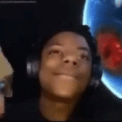 a close up of a person wearing headphones looking up at the camera .