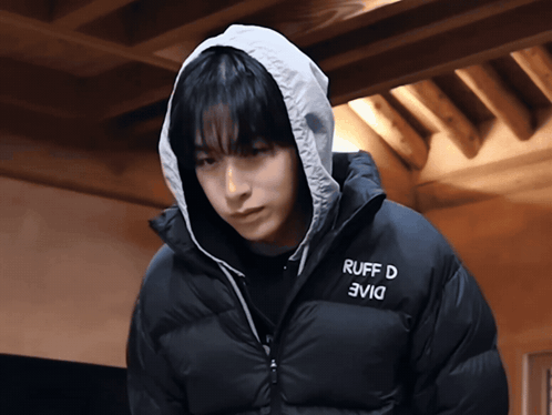 a person wearing a black jacket that says ruff d on the front