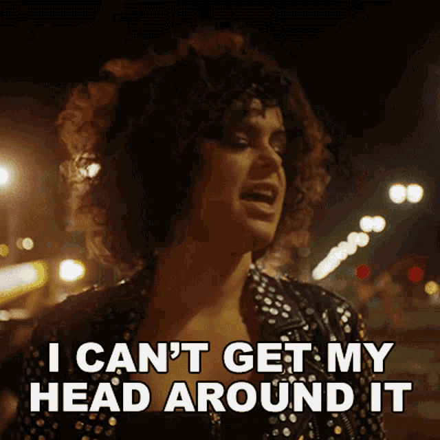 a woman with curly hair is saying i can 't get my head around it