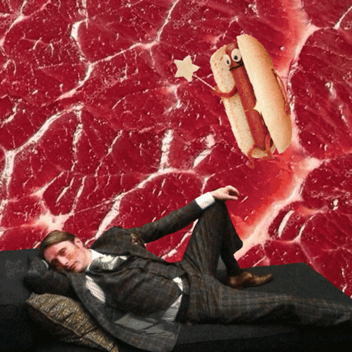 a man in a suit is laying on a couch with a hot dog and a star on it