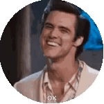 Jim Carrey smiles broadly in a circular crop.
