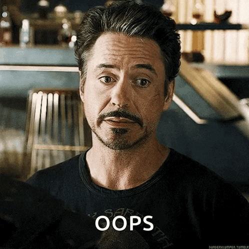 A man looks apologetic under the caption “OOPS.”