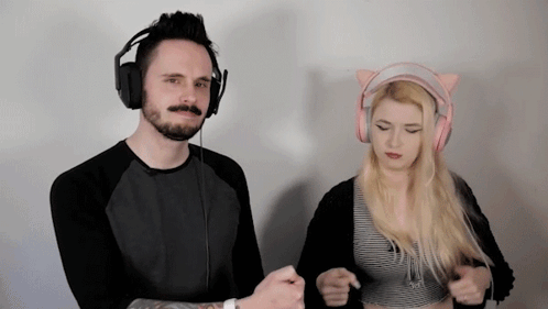 a man wearing headphones and a woman wearing pink headphones