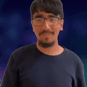 a man wearing glasses is waving his hand