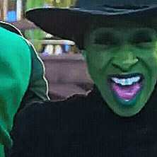 a close up of a person wearing a cowboy hat