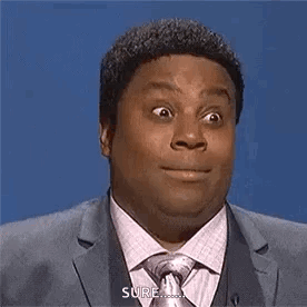 Kenan Thompson gives a wide-eyed, uneasy reaction on a studio set.