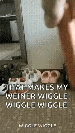 a person is standing in front of a mirror with a bunch of shoes on the ground .