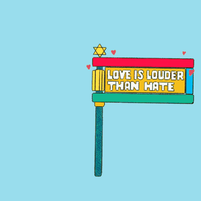a sign that says " love is louder than hate "