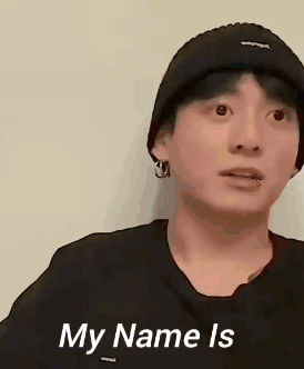 A man in a black cap looks wide-eyed beside the caption “My Name Is.”