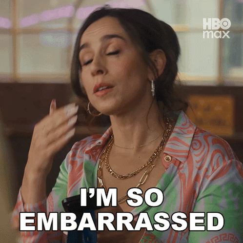 A woman wipes her face beneath the caption “I’M SO EMBARRASSED.”